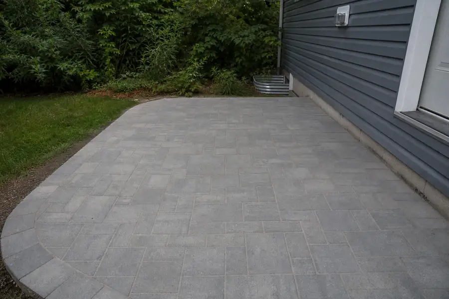 Finished paver patio with sand-swept joints on a compacted stone dust patio base